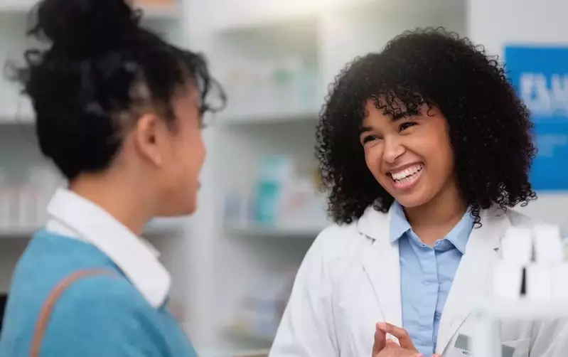 woman talking to pharmacist